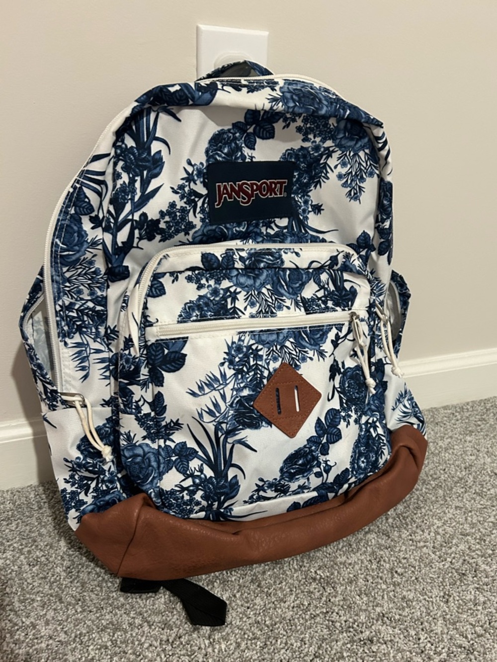 Jansport White Backpack with Blue Floral Print and Brown Base